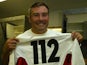 Jason Leonard of England displays a commemorative number 112 jersey after setting a new world record of 112 international apppearances during the Rugby World Cup semi-final against France on November 16, 2013
