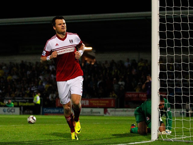 John Arne Riise of Fulham celebrates after scoring the winning goal in the penalty shoot-out during the Capital One Cup Second Round match between Burton Albion and Fulham at the Pirelli Stadium on August 27, 2013