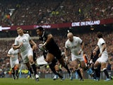 New Zealand's wing Julian Savea runs in to score the opening try during the international rugby union test match between England and New Zealand at Twickenham Stadium on November 16, 2013