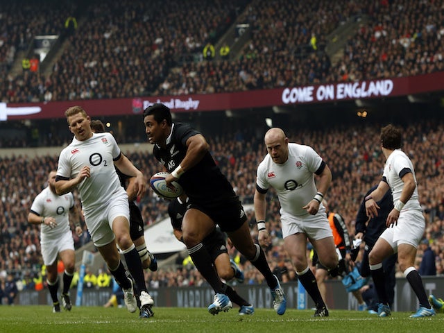 New Zealand's wing Julian Savea runs in to score the opening try during the international rugby union test match between England and New Zealand at Twickenham Stadium on November 16, 2013