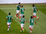 Mexico's forward Raul Jimenez celebrates with teammates after scoring their second goal against New Zealand during their FIFA World Cup intercontinental play-off football match in Mexico City on November 13, 2013