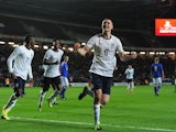 England's Michael Keane celebrates after scoring the opening goal against Finland during their 2015 UEFA European Under 21 Championships Qualifier Group 1 match on November 14, 2013