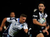 Shaun Johnson of New Zealand runs in to score a try during the Rugby League World Cup Quarter Final match between New Zealand and Scotland at Headingley Stadium on November 15, 2013