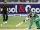 South African captain Faf du Plessis plays a shot during the First T20 International at Dubai stadium on November 13, 2013.