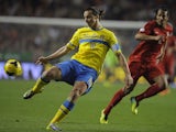 Sweden's forward Zlatan Ibrahimovic kicks the ball next to Portugal's defender Bruno Alves during the FIFA 2014 World Cup qualifier play-off first leg football match Portugal vs Sweden at the Luz stadium in Lisbon on November 15, 2013
