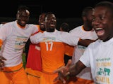 Serge Aurier of Ivory Coast celebrates qualification with team mates after the FIFA 2014 World Cup Qualifier Play-off Second Leg between Senegal and Ivory Coast on November 16, 2013