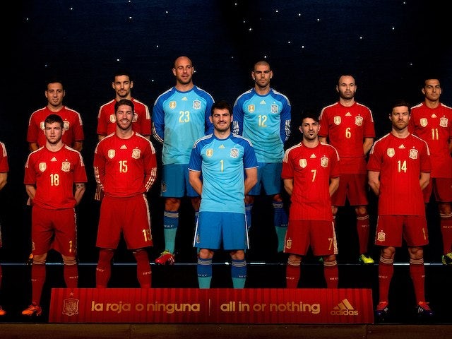 The Spain football team unveil their new all-red football kit in Madrid on November 13, 2013