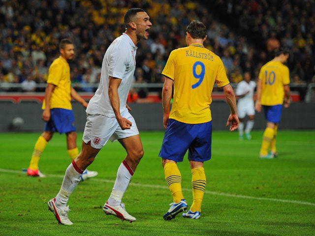 Steven Caulker of England celebrates scoring to make it 2-1 during the international friendly match between Sweden and England at the Friends Arena on November 14, 2012