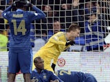 Ukraine's forward Andriy Yarmolenko celebrates next to France's defender Blaise Matuidi and defenders Eric Abidal and Laurent Koscielny after Ukraine scored a goal during the 2014 FIFA World Cup qualifying play-off first leg football match between Ukraine