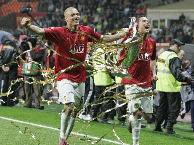 Wes Brown and Cristiano Ronaldo celebrate with the Champions League trophy on May 21, 2008.