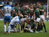 South Africa's Willem Alberts is congratulated by team mates after scoring the opening try against Scotland during their International match on November 17, 2013