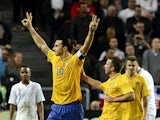 Sweden's striker and team captain Zlatan Ibrahimovic celebrates with his teammates after scoring his 3rd goal of the match during the FIFA World Cup 2014 friendly match England vs Sweden in Stockholm, on November 14, 2012