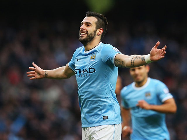 Mac City's Alvaro Negredo celebrates after scoring his team's fifth goal and his second of the match against Tottenham on November 24, 2013