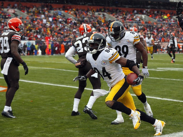 Wide receiver Antonio Brown of the Pittsburgh Steelers celebrates after scoring a touchdown with Jerricho Cotchery against the Cleveland Browns on November 24, 2013