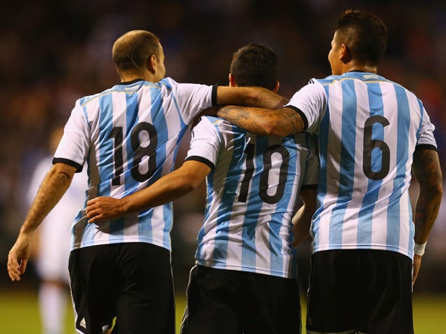 Teammates congratulate Sergio Aguero #10 of Argentina after Aguero scored his second goal of the match during the international friendly match between Bosnia-Herzegovina and Argentina at Busch Stadium on November 18, 2013 
