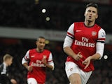 Arsenal's French striker Olivier Giroud celebrates scoring his second goal from the penalty spot during the English Premier League football match between Arsenal and Southampton at the Emirates Stadium in London on November 23, 2013