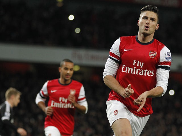 Arsenal's French striker Olivier Giroud celebrates scoring his second goal from the penalty spot during the English Premier League football match between Arsenal and Southampton at the Emirates Stadium in London on November 23, 2013