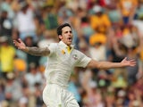 Mitchell Johnson of Australia celebrates after dismissing Joe Root of England during day two of the First Ashes Test match between Australia and England at The Gabba on November 22, 2013