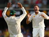 Ryan Harris of Australia celebrates dismissing Michael Carberry of England during day three of the First Ashes Test match between Australia and England at The Gabba on November 23, 2013