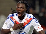 Lyon's French forward Bafetimbi Gomis celebrates after scoring a goal during the French L1 football match against Valenciennes on November 23, 2013