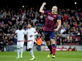 Barcelona's midfielder Andres Iniesta celebrates after scoring during the Spanish league football match FC Barcelona vs Granada CF at the Camp Nou stadium in Barcelona on November 23, 2013