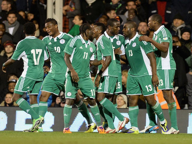 Bright Dike of Nigeria celebrates scoring the first goal during the international friendly match between Italy and Nigeria at Craven Cottage on November 18, 2013