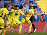 Villarreal's Bruno Soriano celebrates with teammates after scoring the opening goal via the penalty spot against Levante on November 24, 2013
