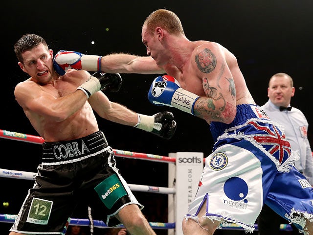 Carl Froch and George Groves in action during their IBF & WBA World Super Middleweight Title fight on November 23, 2013