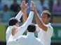 Chris Tremlett of England celebrates with team mates after dismissing Steve Smith of Australia during day one of the First Ashes Test match on November 21, 2013
