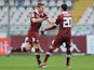 Torino's Ciro Immobile celebrates with teammate Giuseppe Vives after scoring the opening goal against Catania during their Serie A match on November 24, 2013