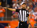 Referee Clete Blakeman makes a call during a game between the St. Louis Rams and Denver Broncos at Sports Authority Field at Mile High on August 24, 2013
