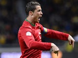 Portugal's Cristiano Ronaldo celebrates after scoring the opening goal against Sweden during their World Cup play-off match on November 19, 2013