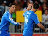 Real Madrid's Portuguese forward Cristiano Ronaldo celebrates with his teammate midfielder Xabi Alonso after scoring during the Spanish league football match against UD Almeria on November 23, 2013