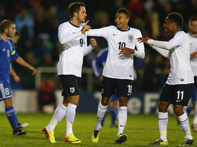England's Danny Ings is congratulated by teammates after scoring his team's third goal against San Marino during their U21 Euro 2015 qualifying match on November 19, 2013