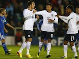 England's Danny Ings is congratulated by teammates after scoring his team's third goal against San Marino during their U21 Euro 2015 qualifying match on November 19, 2013