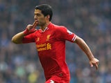 Luis Suarez of Liverpool celebrates scoring his team's second goal during the Barclays Premier League match between Everton and Liverpool at Goodison Park on November 23, 2013