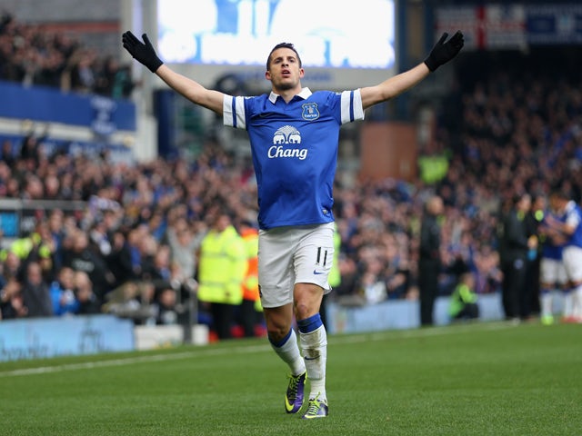 Kevin Mirallas of Everton celebrates scoring his team's first goal during the Barclays Premier League match between Everton and Liverpool at Goodison Park on November 23, 2013