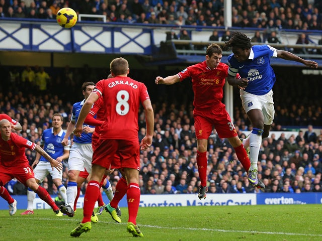 Romelu Lukaku of Everton scores his team's third goal during the Barclays Premier League match between Everton and Liverpool at Goodison Park on November 23, 2013