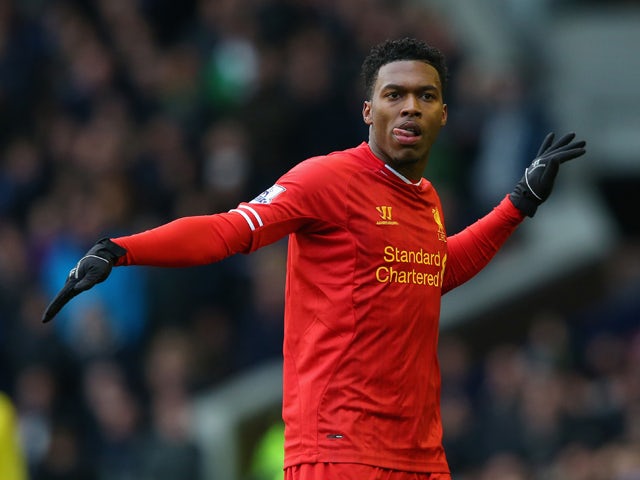 Daniel Sturridge of Liverpool celebrates scoring his team's third goal during the Barclays Premier League match between Everton and Liverpool at Goodison Park on November 23, 2013