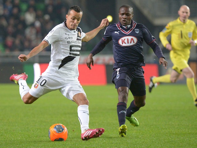 Rennes' Algerian midfielder Foued Kadir vies with Bordeaux's Cameroonese midfielder Landry Nguemo during the French L1 football match Rennes vs Bordeaux on November 23, 2013