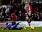 George Saville of Brentford breaks away from the challenge of Byron Moore of Crewe during the Sky Bet League One match between Brentford and Crewe Alexandra at Griffin Park on November 16, 2013