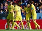 Villarreal 's Ikechukwu Uche celebrates with teammates after scoring his team's third goal against Levante on November 24, 2013