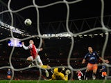 Arsenal's English midfielder Jack Wilshere scores his team's first goal during the UEFA Champions League Group B football match against Montpellier on November 21, 2012
