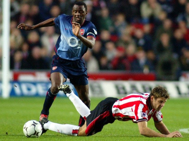 James Beattie, then of Southampton, battles for possession against Arsenal on November 23, 2002.