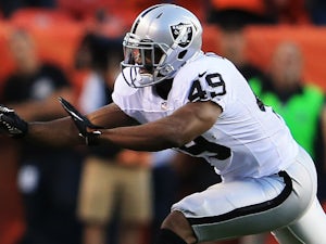 Jamize Olawale of the Oakland Raiders in action against the Denver Broncos on September 23, 2013