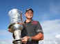 Jason Day poses with the trophy after winning the tournament in the final round of the World Cup of Golf on November 24, 2013