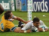England's Jason Robinson dives over to score a try against Australia during the final of the World Cup on November 22, 2003