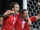 England's John Terry and Matthew Upson celebrate the latter's goal against Germany on November 19, 2008.