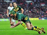 Australia's Johnathan Thurston scores a try during the 2013 Rugby League World Cup semi-final match between Australia and Fiji at Wembley Stadium in London, England on November 23, 2013