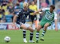 Josh Wright of Millwall contests the ball with Edward Upson of Yeovil during the Sky Bet Championship match between Millwall and Yeovil Town at The Den on August 03, 2013